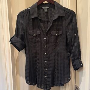 Slightly sheer black blouse.